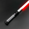 A premium metal lightsaber with an illuminated red blade and silver hilt against a dark background.