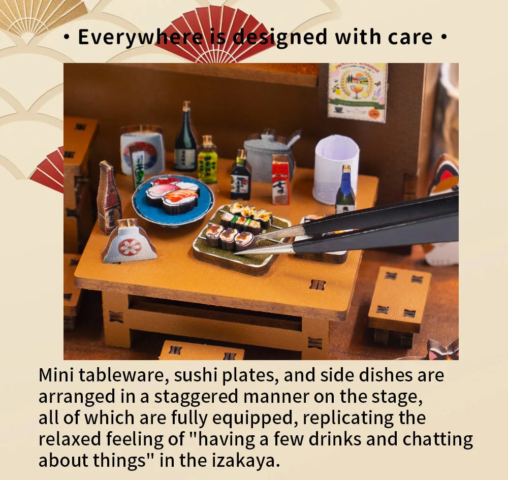 A detailed diorama showing mini tableware, sushi plates, and side dishes arranged on a wooden stage.