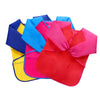 A collection of brightly colored waterproof kids art and baking aprons with long sleeves.
