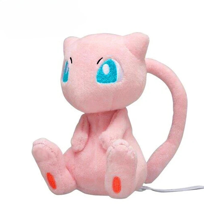 A pink Kawaii anime plush doll with blue eyes sitting down.
