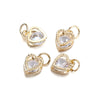 Two gold-toned heart charms with clear rhinestones, designed for jewelry making.