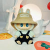 A Labubu doll wearing a beige hat and black bear hoodie with headphones, displayed against a white background.
