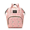 Pink cartoon print waterproof diaper bag with a black strap and zippered pockets