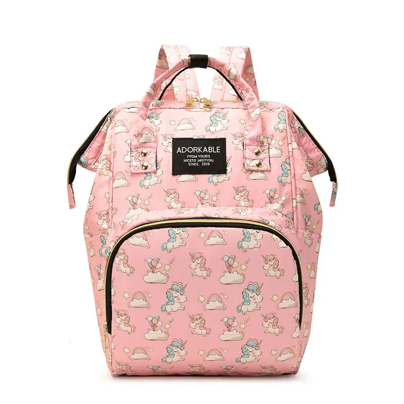 Pink cartoon print waterproof diaper bag with a black strap and zippered pockets