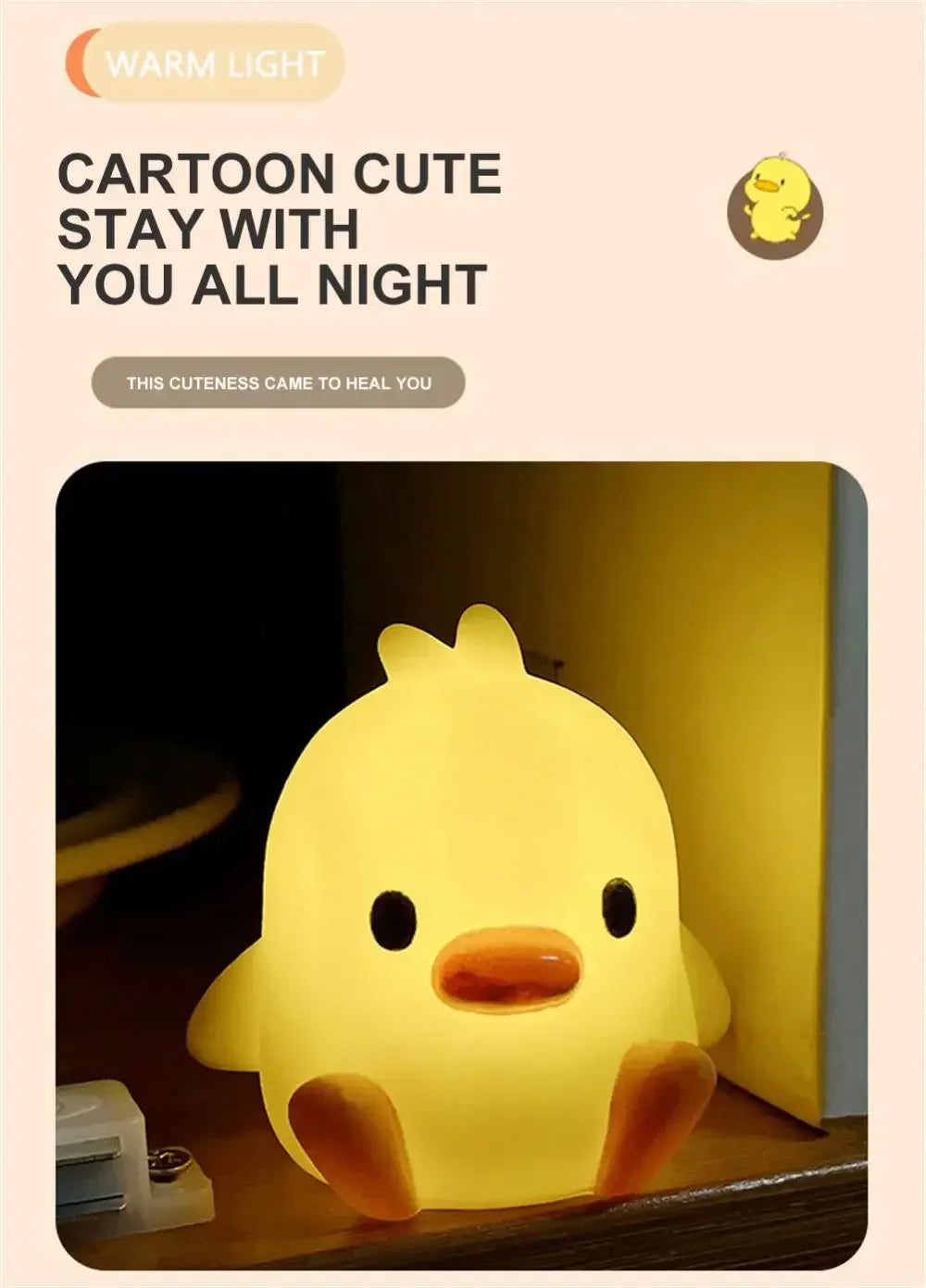 A yellow cartoon duck night light emitting warm light on a wooden surface.