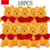 Ten yellow Winnie the Pooh plush toys with red shirts and ears