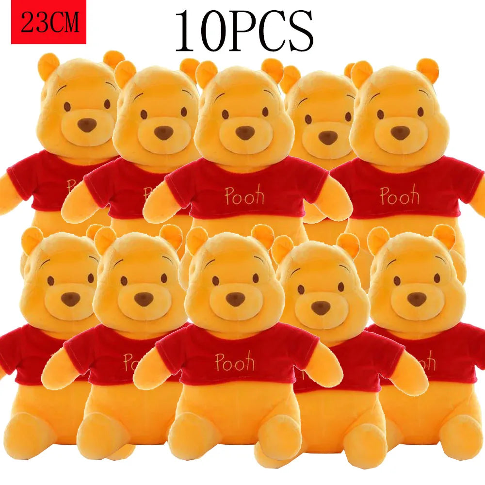 Ten yellow Winnie the Pooh plush toys with red shirts and ears