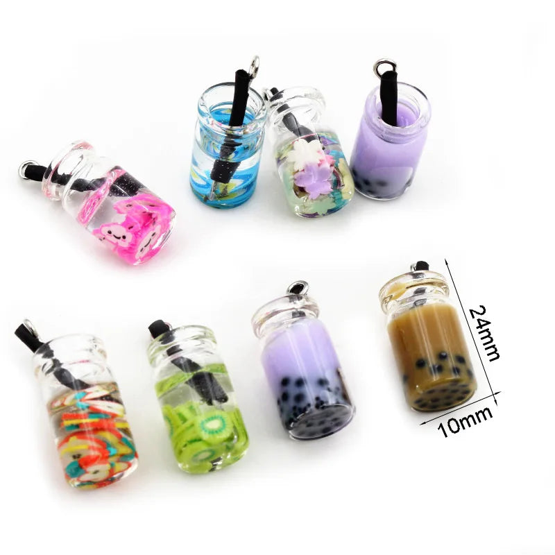 A collection of assorted resin fruit and drink charms in various colors and shapes for jewelry making.