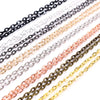 A collection of various handmade flattened chain connectors in silver, gold, and bronze tones.