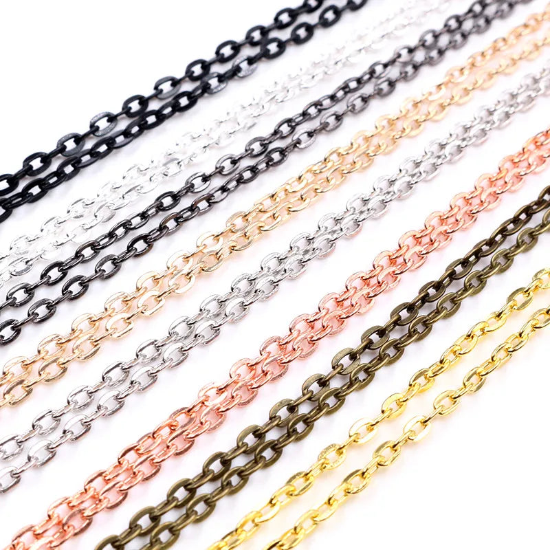 A collection of various handmade flattened chain connectors in silver, gold, and bronze tones.