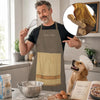 A man wearing a brown chef apron is shown with a dog in a kitchen setting.
