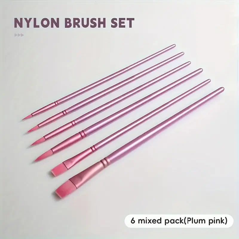 A set of six mixed plum pink nylon paint brushes laid diagonally on a white background.