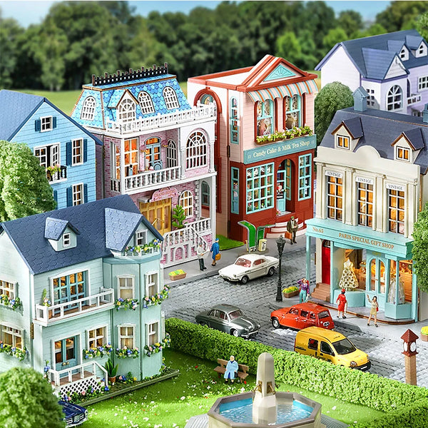 A detailed diorama of a DIY miniature wooden dollhouse kit featuring colorful houses and landscaping.