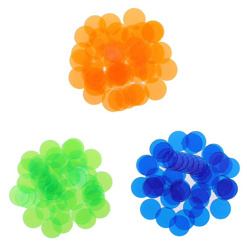 A collection of 50 plastic bingo chips in shades of orange and green.