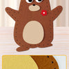 A brown felt bear craft kit with a cutout for stuffing and a small red flower detail.
