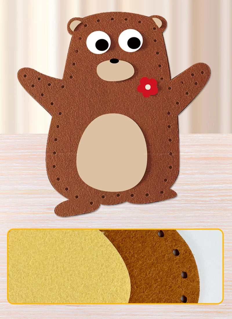 A brown felt bear craft kit with a cutout for stuffing and a small red flower detail.