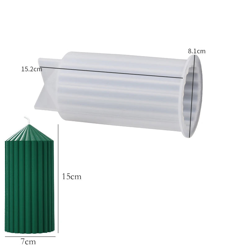 A white silicone mold for candles or soap with a striped design shown next to a green cylindrical object.