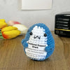 Handcrafted crochet shark doll with a white tooth design and an emotional support tag