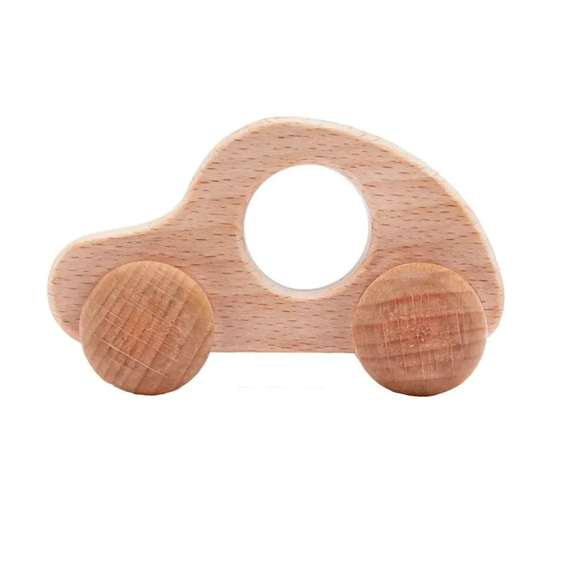 A wooden Montessori push cart toy shaped like a car or bus, handcrafted from light-colored beech wood.