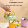 A hand holds a yellow insulated stainless steel breakfast cup with a green lid, demonstrating its heat-resistant and insulate