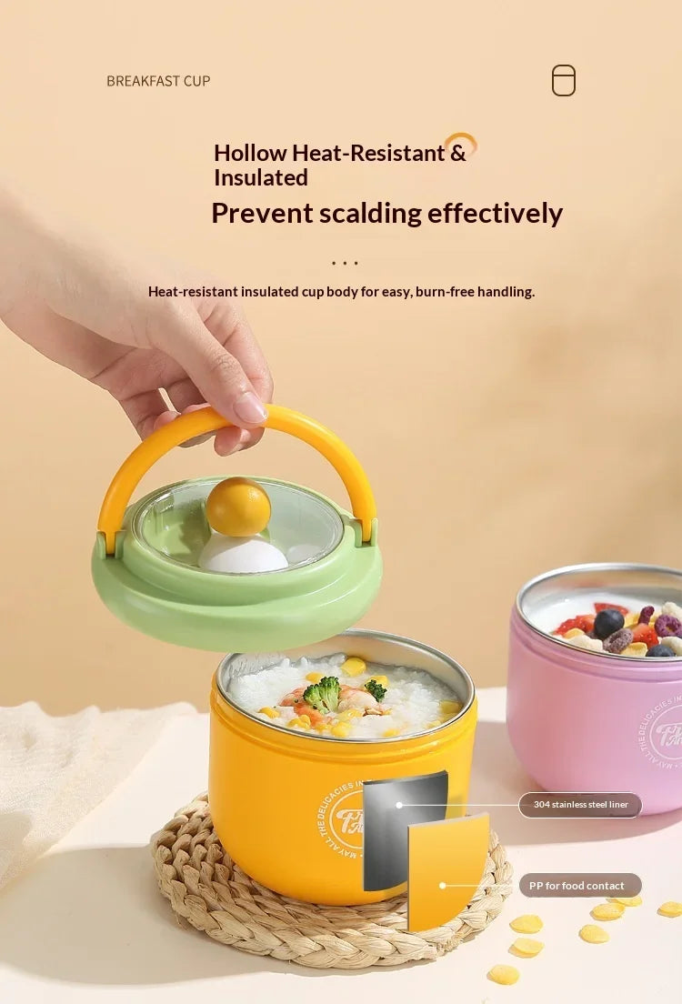 A hand holds a yellow insulated stainless steel breakfast cup with a green lid, demonstrating its heat-resistant and insulate