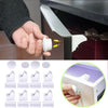 A hand is shown installing a magnetic cabinet door lock for child safety onto a cabinet door.