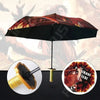 A black umbrella featuring a Demon Slayer theme with red and orange patterns, shown alongside a katana sword.