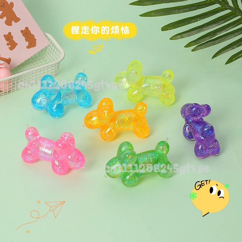 A collection of translucent squishy toys in various colors including blue, yellow, orange, and purple