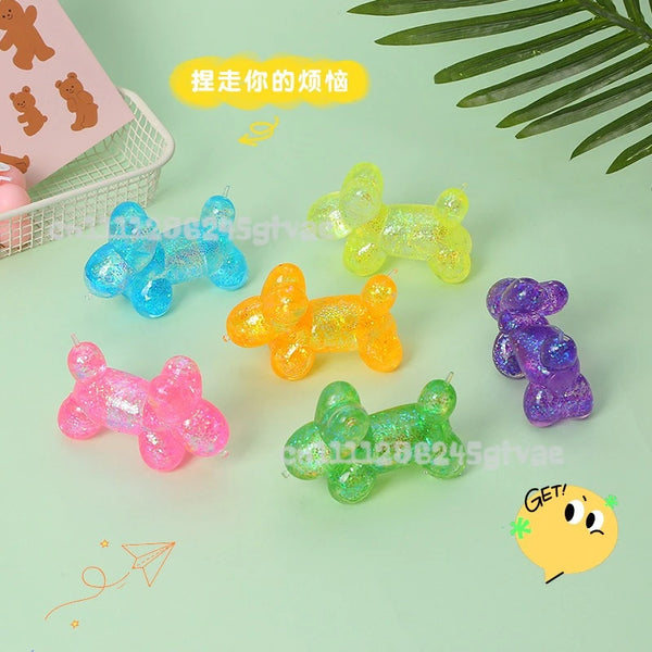 A collection of translucent squishy toys in various colors including blue, yellow, orange, and purple