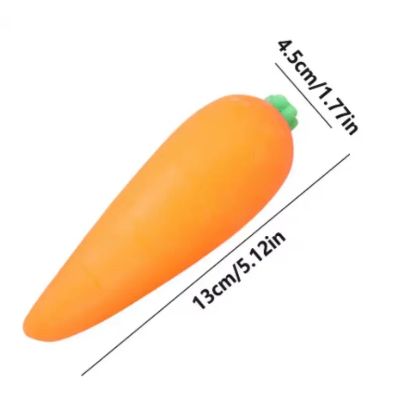 An orange carrot squishy stress relief toy with a green tip, shown in profile.