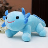 A light blue axolotl plush toy with large eyes and pink accents sitting on a white surface.