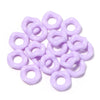 A pile of purple acrylic doughnut spacer beads for jewelry making