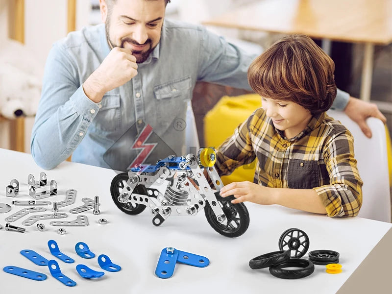 A child and adult are assembling a detailed metal building motorcycle construction kit on a white table.