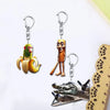 Acrylic keychain featuring a cartoon monkey and a cartoon man design