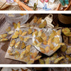 A collection of colorful butterfly stickers for scrapbooking and journaling displayed on a wooden surface.