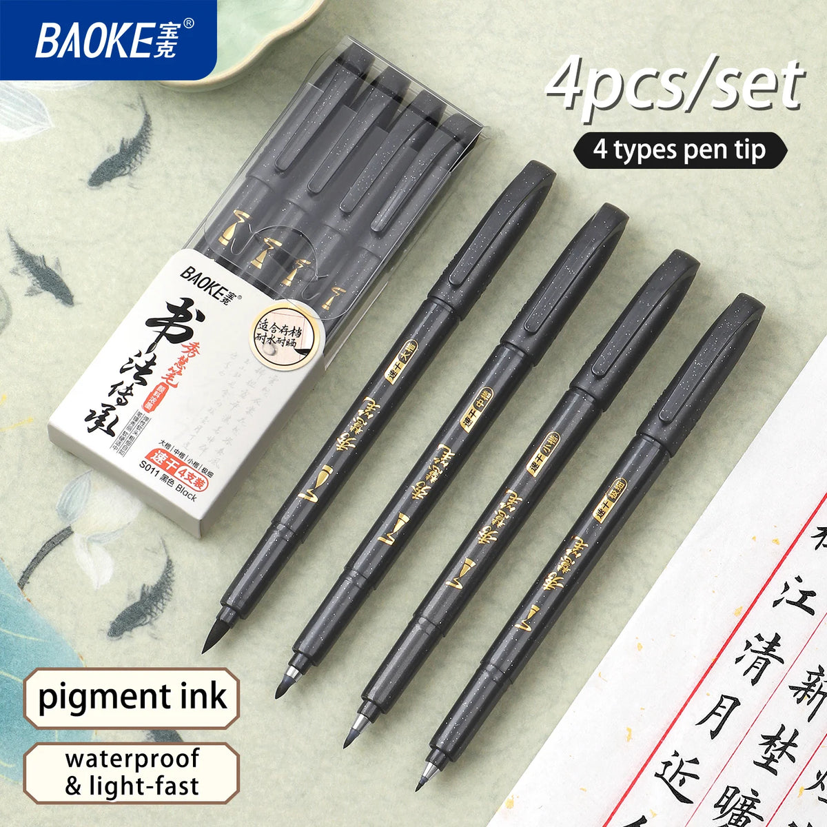 A set of four black brush pens with soft tips for calligraphy, packaged in a clear case.
