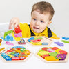 A baby is interacting with a wooden 3D jigsaw puzzle set featuring various colorful shapes and animals.