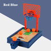 A red and blue mini tabletop basketball arcade game featuring a hoop and court for two players.