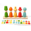 A set of wooden stacking toys depicting various emotions in different colors and sizes.