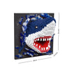 A building block set depicting a shark head in blue and white colors.