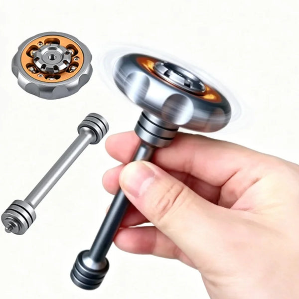 A hand holds a metal fingertip windmill fidget toy, showing the top mechanism and the shaft.