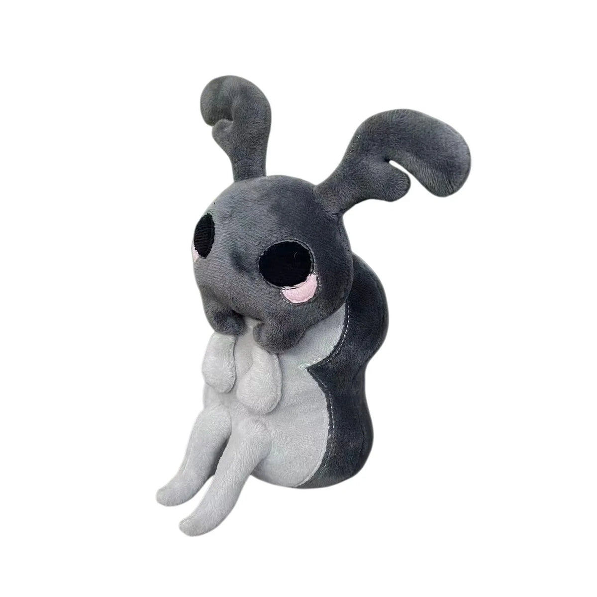 A gray plush doll resembling a rabbit with large ears and a dark body.