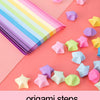Colorful origami star paper strips and folded shapes arranged on a pink background.
