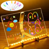 A clear acrylic message board displays colorful drawings and text, illuminated by a light source.