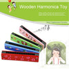 A set of pink and green wooden harmonica toys with cartoon animal designs.