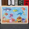 A 24-piece wooden jigsaw puzzle featuring various colorful sea animals like a shark, fish, and dolphins.