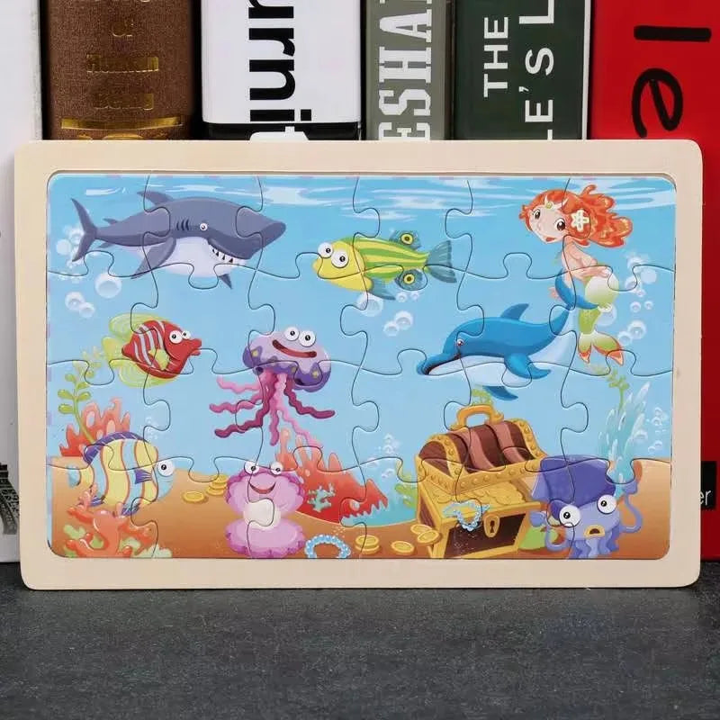 A 24-piece wooden jigsaw puzzle featuring various colorful sea animals like a shark, fish, and dolphins.