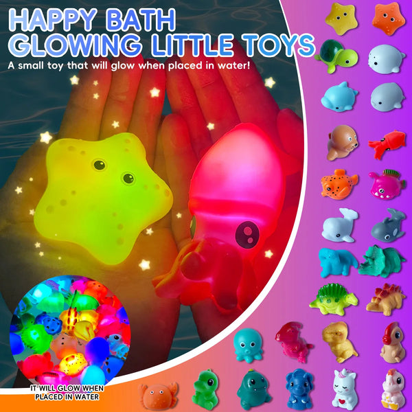 A hand holds a glowing yellow toy dinosaur and a pink glowing toy, with other bath toys visible.