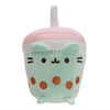 A soft pastel pink and mint green plush cat toy with large eyes and rounded ears.
