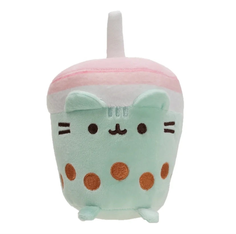 A soft pastel pink and mint green plush cat toy with large eyes and rounded ears.